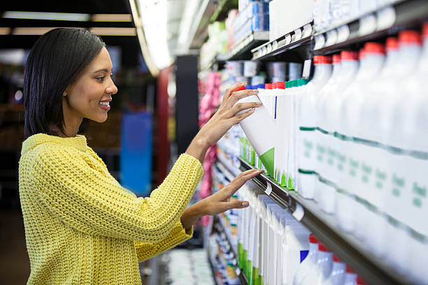 istock Woman buying milk from dairy section 628482940