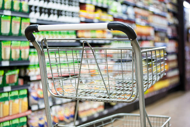 istock Empty shopping cart in grocery section 628483398