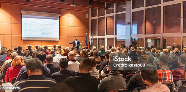 Business Speaker Giving A Talk In Conference Hall Stock Photo - Download Image Now - Meeting, Conference - Event, Convention Center