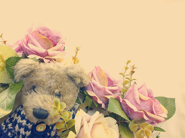 teddy bear with bunch of flowers copy space background made with vintage filter color