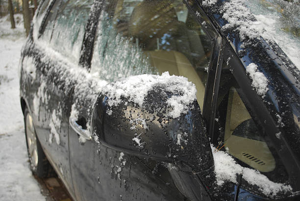 istock Black car covered with snow and ice. 628497990