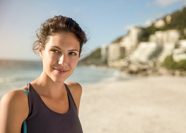 istock Thoughtful female athlete at beach 628498154