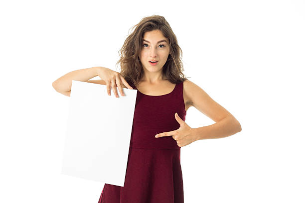 istock girl in red dress with white placard 628498620