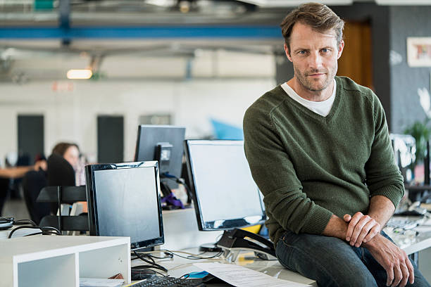 istock Portrait of businessman in creative office 628498818