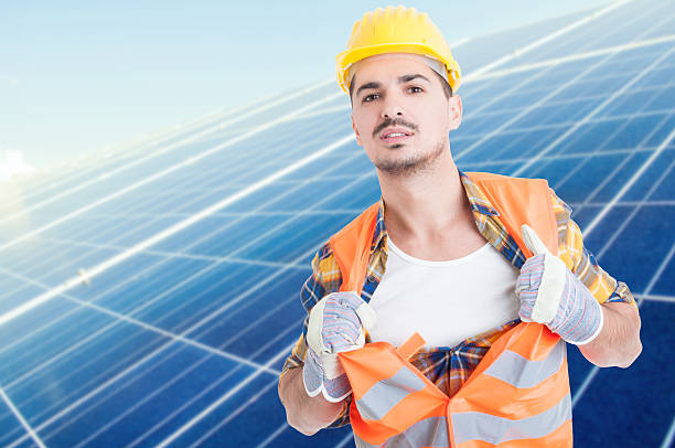 istock Attractive male builder acting like super hero 628503864