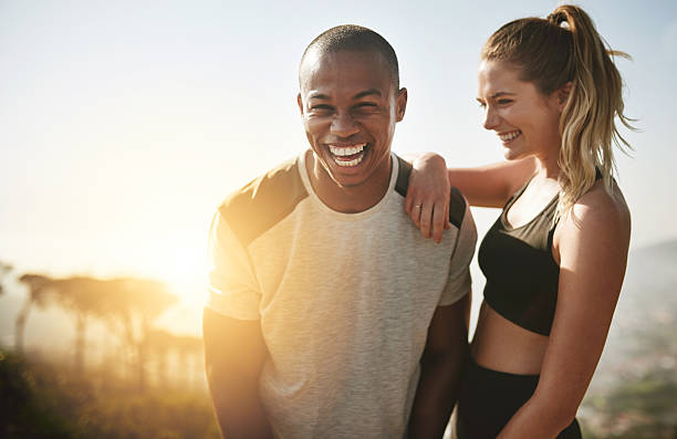 è la mia più grande motivatrice di fitness - couple young adult african descent multi ethnic group foto e immagini stock