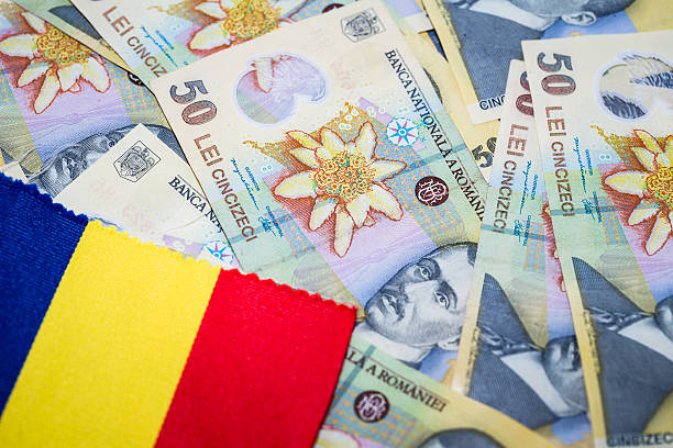 istock Overhead view of Romanian currency and Romania Flag 628504952
