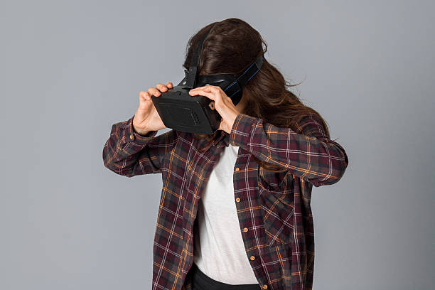 istock beautiful woman in virtual reality helmet 628505594
