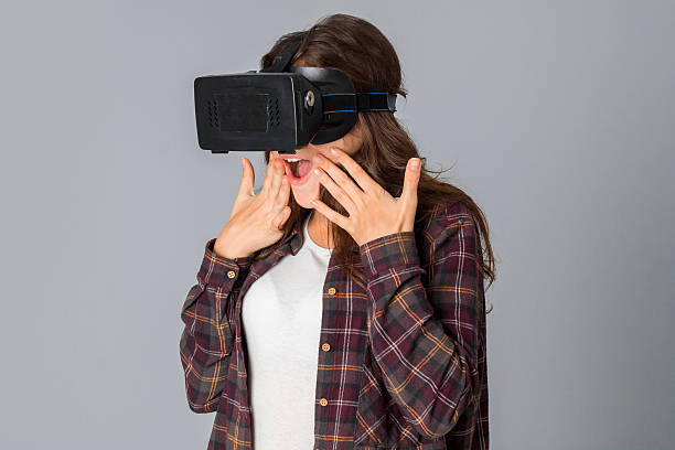 istock cheerful woman in virtual reality helmet 628505838