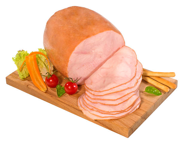 Smoked turkey Sliced smoked turkey breast on a cutting board,isolated on white with clipping path. turkey breast stock pictures, royalty-free photos & images