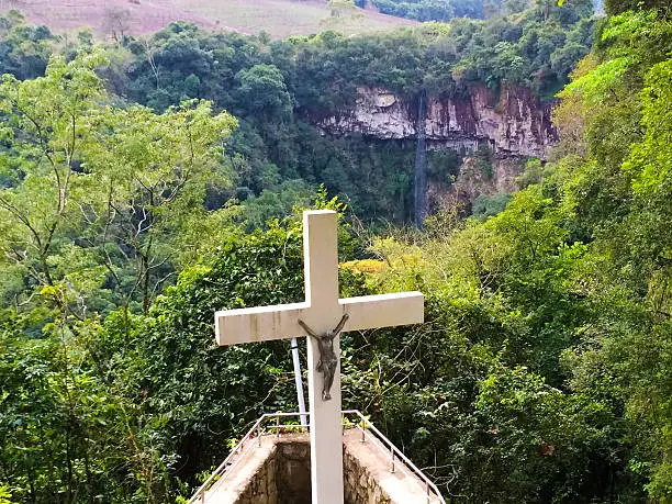 Cross on a forest with waterfall in south of Brazil.