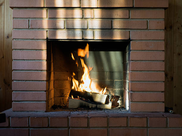 istock The brick fireplace firewood. Burning fire. Bright flames 628516622