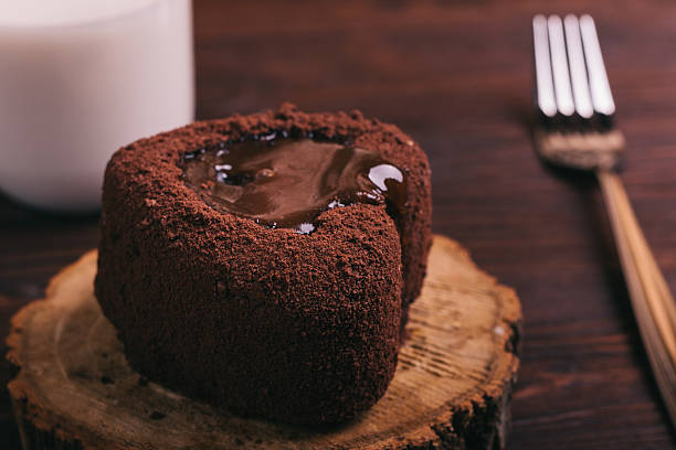 istock Chocolate cake, a glass of milk and a fork 628516750