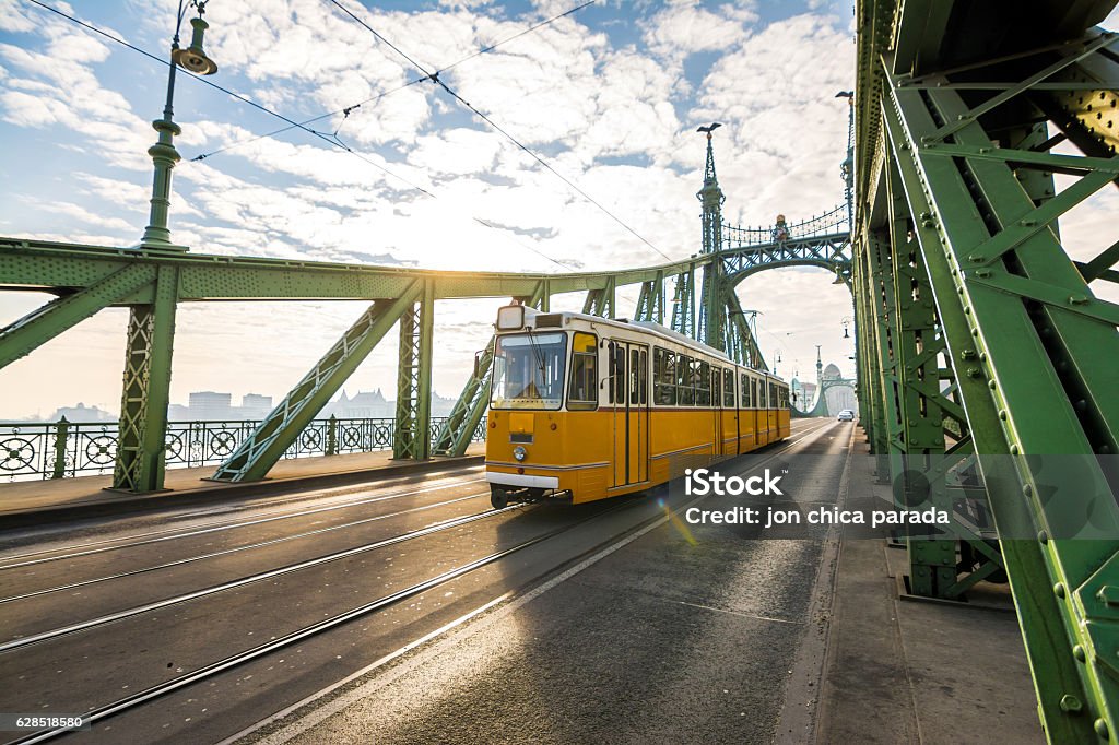 trolley car crossing liberty bridge at budapest, hungary Budapest Stock Photo