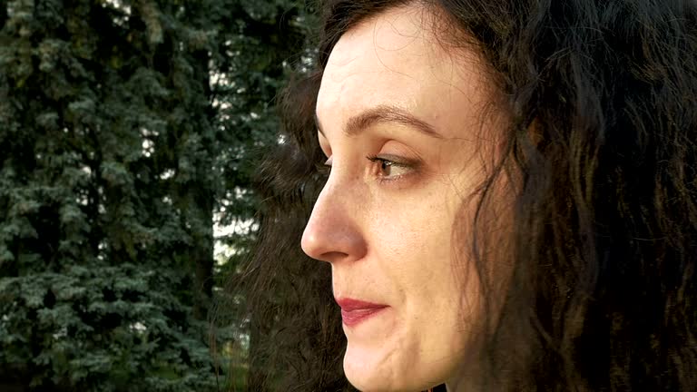 Pretty brunette long hair girl portrait outdoors