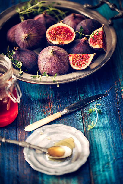 istock Figs and Sweet Honey on Wooden Background 628524628