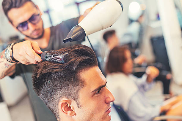 istock Attractive young man at hair stylist 628526148