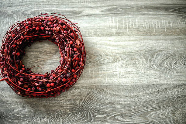 istock Christmas wreath on a rustic wooden background 628527578