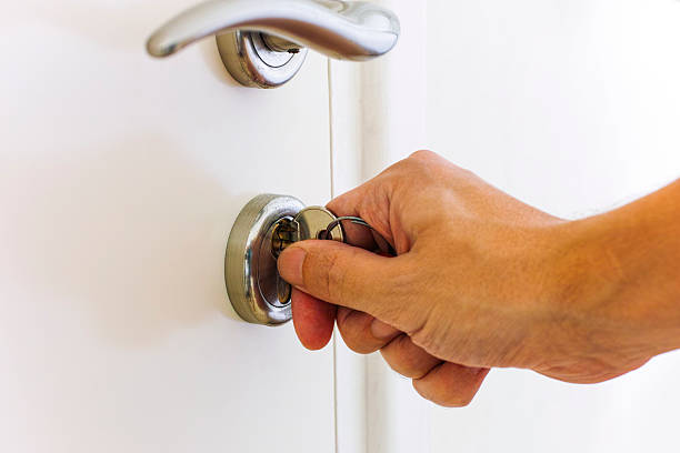 istock Person hand opening door by key 628536300
