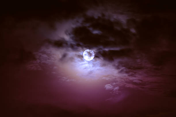 istock Nighttime sky with clouds and bright full moon with shiny. 628537010