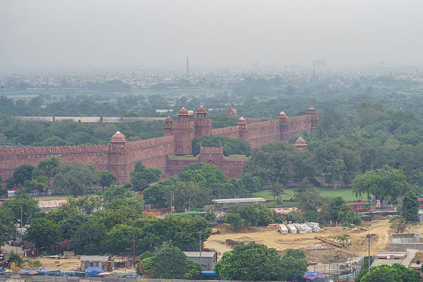 aerial view of the red fort in delhi under the misty sky