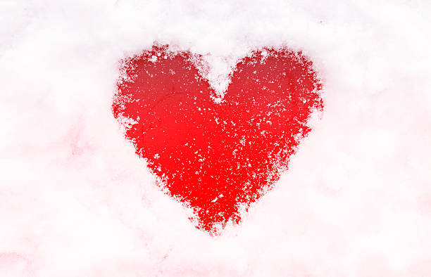 istock Red heart shape in the snow. 628541282