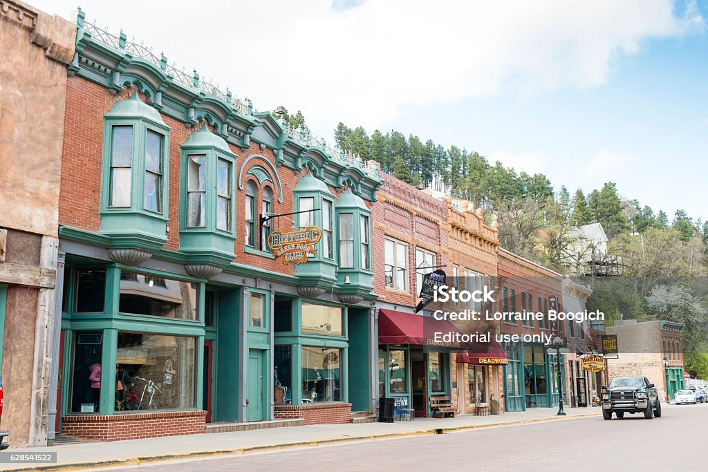 Deadwood South Dakota Wild Western Small Town American History USA Deadwood, United States - May 8, 2016: Historic buildings in this Western South Dakota town remain active with a variety of retail businesses. Few cars drive along the quiet streets. South Dakota Stock Photo