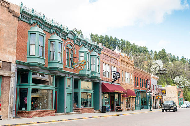 Deadwood South Dakota Wild Western Small Town American History USA Deadwood, United States - May 8, 2016: Historic buildings in this Western South Dakota town remain active with a variety of retail businesses. Few cars drive along the quiet streets. south dakota photos stock pictures, royalty-free photos & images