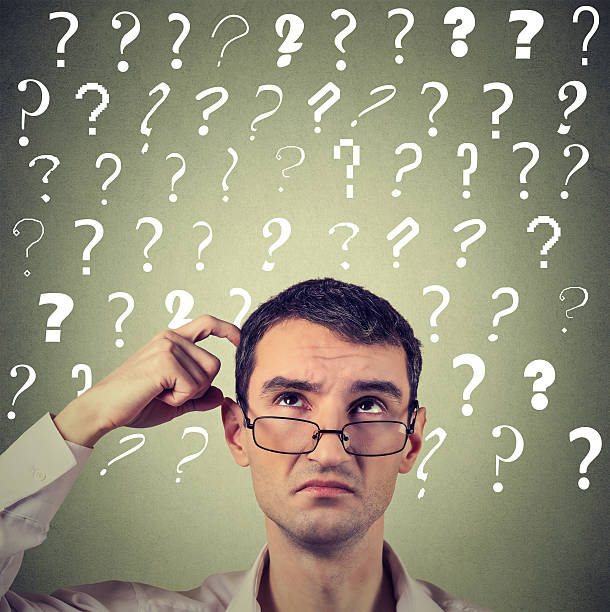 istock confused thinking man in glasses scratching head has questions 628541528