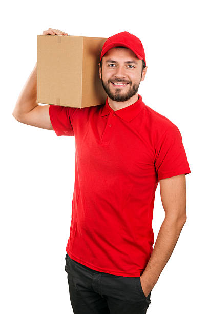 istock delivery man holding shipping box on the shoulder 628550622