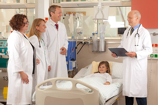 istock resident doctors on  their ward round 628551036