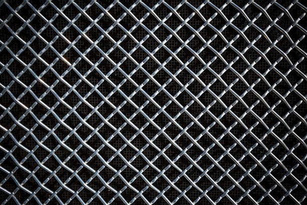 istock metal mesh or aluminum grid on black background 628558376