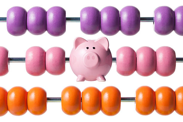 istock Calculate savings. Abacus with piggy bank. 628559978