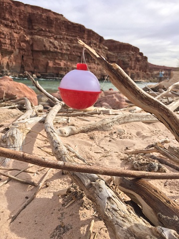 Unique fishing lure, with the best fishing spot in the background.  Colorado river near page Arizona, was one of the most beautiful places I have been. Lee's Ferry landing is in Glen Canyon near the Grand Canyon.