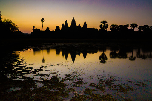 Angkor Wat is a UNESCO World Heritage site in Cambodia. This is a photo taken in the morning dawn, with a pool reflection in the foreground.