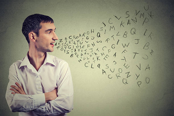 istock Man talking alphabet letters coming out of mouth 628560866