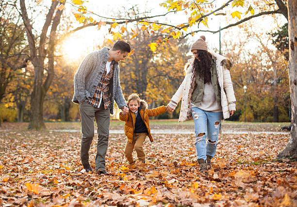 istock Happy Family walking at the park 628563368