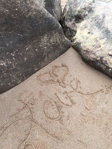River rocks with Love written in the sand, from Lee's Ferry, near Page Arizona