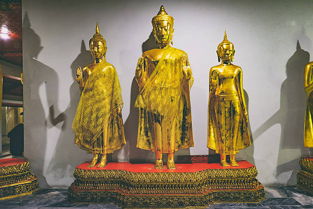 Bangkok, Thailand - December 7, 2015: Row Of Buddha statue at night in Wat Pho or Wat Phra Chetupon Vimolmangklararm, Bangkok, Thailand
