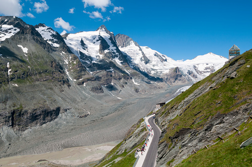 People enjoy the view of the Pasterze Glacier on the eastern slope of the 3,798 m Grossglockner, Austria's tallest mountain, located one the Grossglockner High Alpine Road. The glacier is shrinking by about 10 meters, or 33 feet, each year.