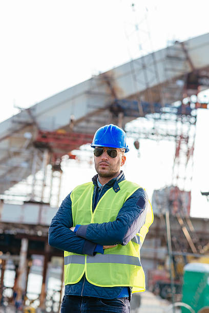 istock Engineer posing with arms crossed near the bridge 628578786