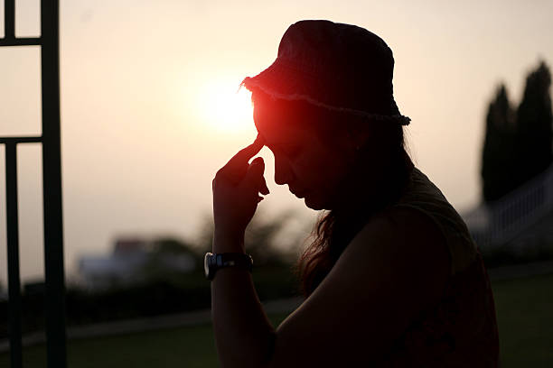 istock Silhouette of a women thinking something 628580542