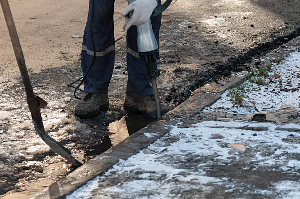 istock man working a jackhammer on a city street 628581018