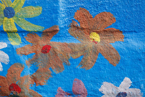 istock blue brick wall painted with colorful flowers, bricks 628581046
