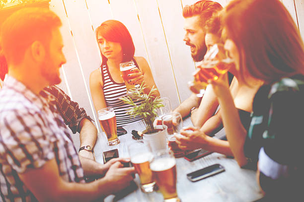 istock Group Of Friends Enjoying Drink 628581698