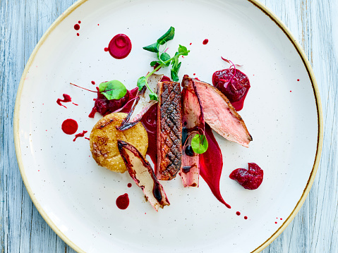 Roast Duck with beetroot sauce with fried potatoes and beetroot chunks