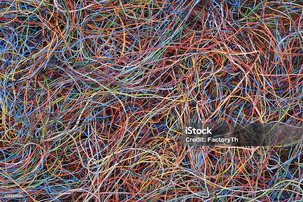 Colored telecommunication cables and wires Colored telecommunication cables and wires as background Chaos Stock Photo