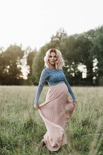 istock Beautiful pregnant woman outdoors in nature 628593204