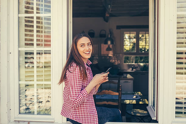 istock Happy woman resting on the window sill 628594908