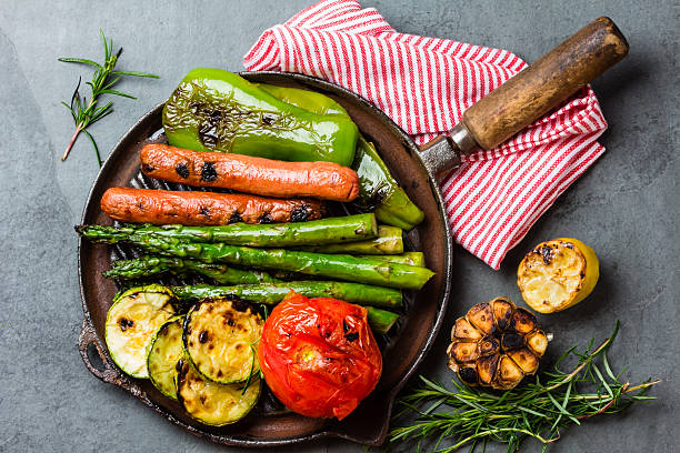 istock Grilled vegetables zucchini, asparagus, bell pepper, sausages on grill pan 628596088
